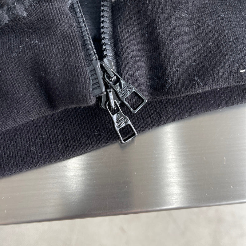 Flat lay presentation of Louis Vuitton luxury clothing with everyday silhouette