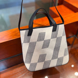 Side view of polished structured handbag