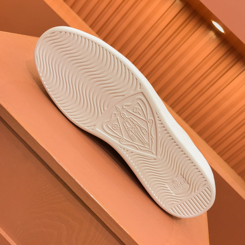 Side profile of Gucci neutral cream sneakers minimalist modern build