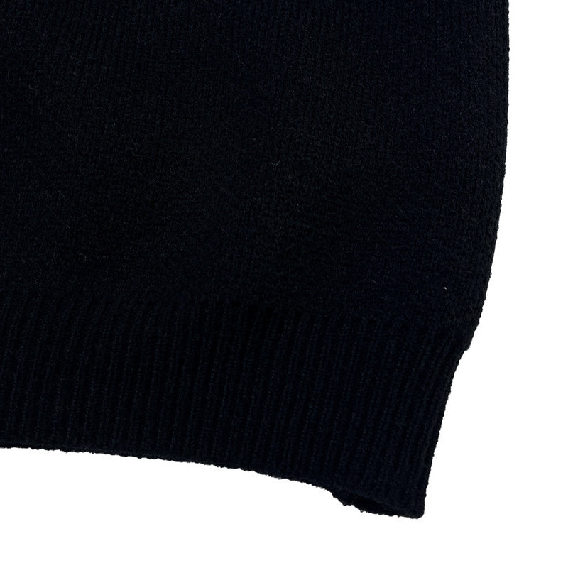 Side profile of Louis Vuitton luxury clothing with label-forward styling