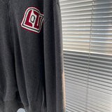 Close-up detail shot of Louis Vuitton luxury clothing with relaxed-fit cut