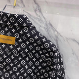 Side profile of Louis Vuitton luxury clothing with label-forward styling
