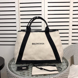 Front view of refined modern women's handbag – women's luxury accessory