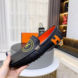 Hermès Chocolate Brown Loafer Flats - Close-Up Texture View