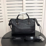 Front view of elevated modern women's handbag – women's statement bag