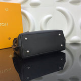 Styled lifestyle shot of polished signature women's handbag – women's designer-style accessory