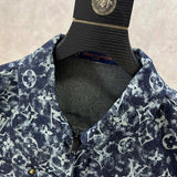 Close-up detail shot of Louis Vuitton luxury clothing with runway-inspired design