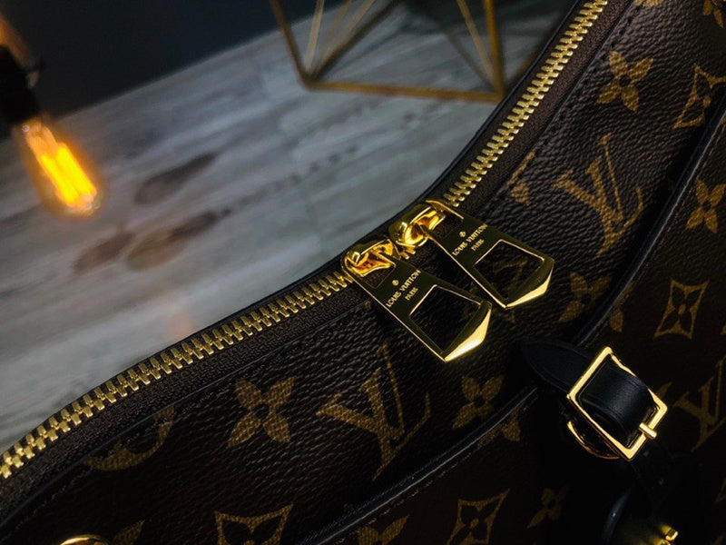 Handle and strap detail of polished structured women's handbag – women's luxury accessory