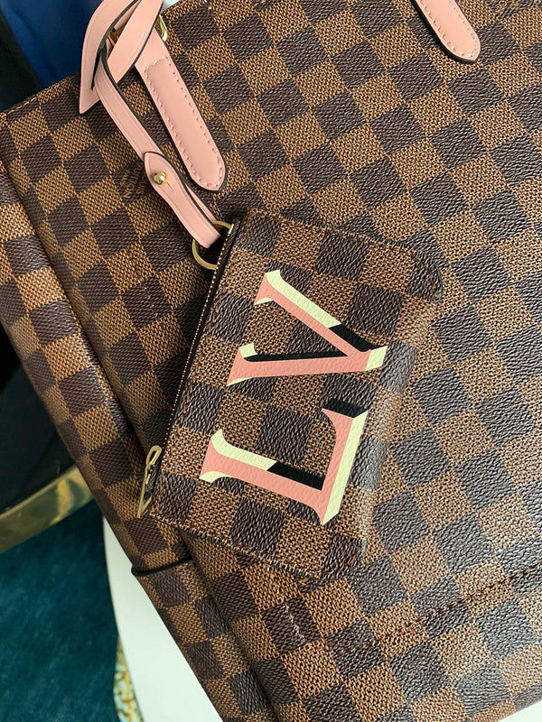 Close-up detail of classic signature women's handbag – women's luxury handbag