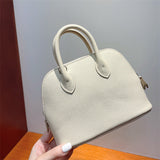 Close-up detail of poised bag design
