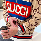 Close-up detail shot of Gucci luxury clothing with logo-detail design