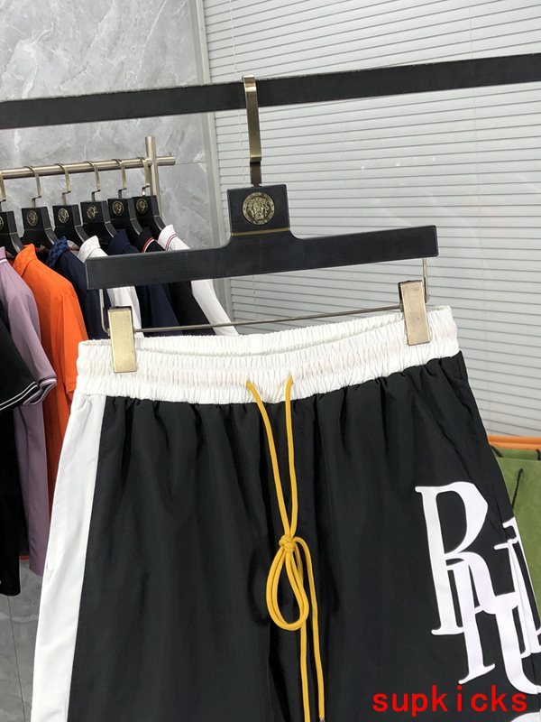 Close-up detail shot of Rhude luxury clothing with label-forward styling