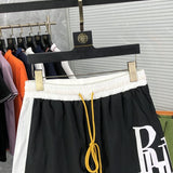 Close-up detail shot of Rhude luxury clothing with label-forward styling