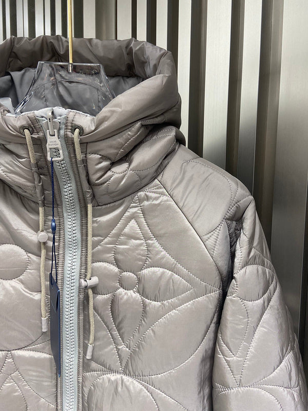 Close-up detail shot of Louis Vuitton luxury clothing with logo-detail design