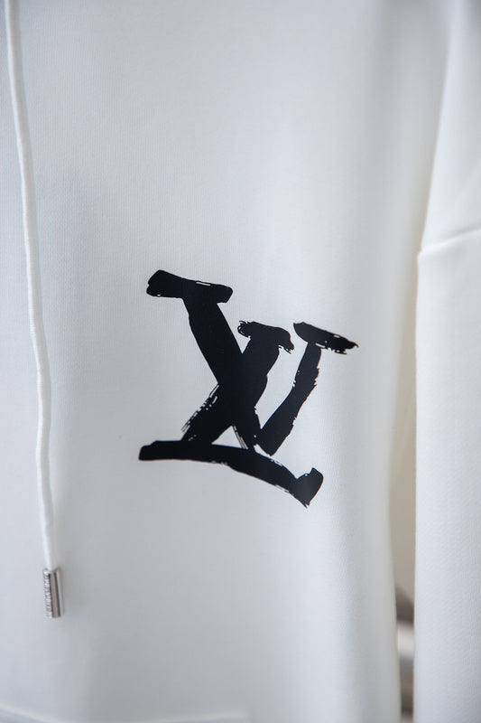Flat lay presentation of Louis Vuitton luxury clothing with relaxed-fit cut