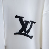 Flat lay presentation of Louis Vuitton luxury clothing with relaxed-fit cut