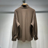 Side profile of Louis Vuitton luxury clothing with monogram-inspired silhouette