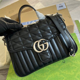 Back view of structured polished women's handbag – women's statement bag