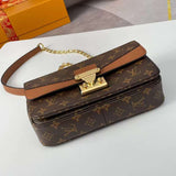 Styled lifestyle shot of sleek signature women's handbag – women's luxury accessory