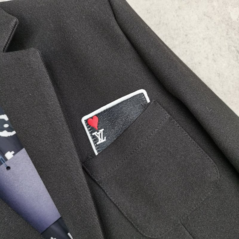 Flat lay presentation of Louis Vuitton luxury clothing with logo-detail design