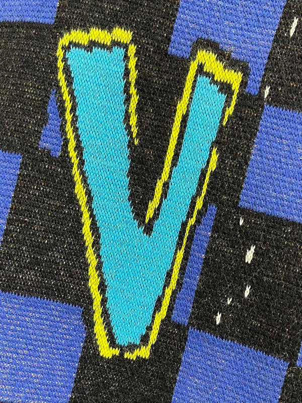 Front view of Louis Vuitton luxury clothing with logo-detail design