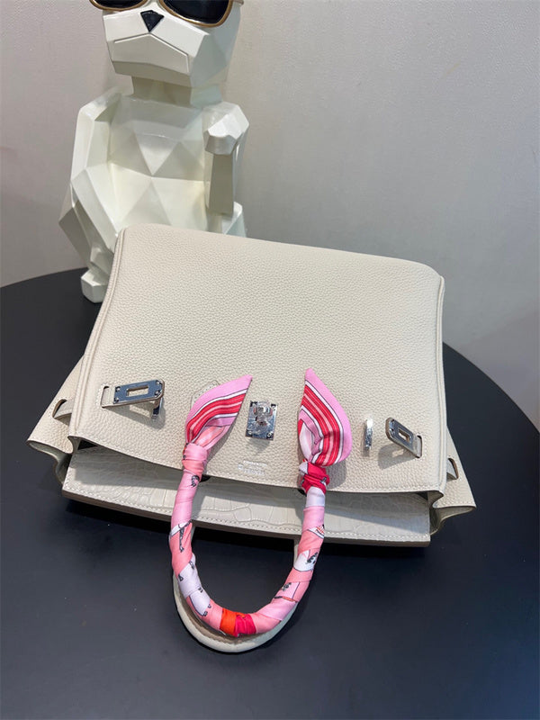  Sleek structured bag carried on shoulder 22