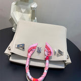  Sleek structured bag carried on shoulder 22