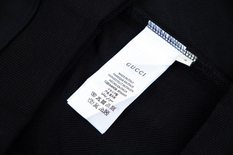 Close-up detail shot of Gucci luxury clothing with contemporary cut