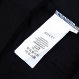 Close-up detail shot of Gucci luxury clothing with contemporary cut