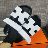 Hermès Black Slide Sandals - Side Profile View