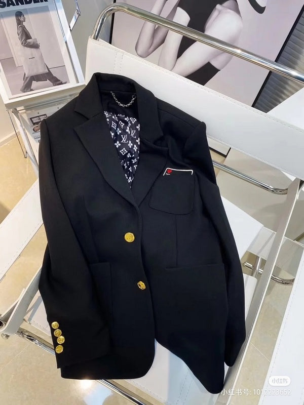 Flat lay presentation of Louis Vuitton luxury clothing with logo-detail design