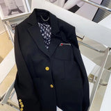 Flat lay presentation of Louis Vuitton luxury clothing with logo-detail design