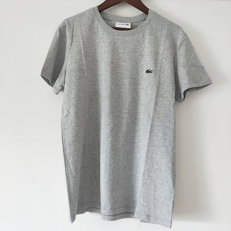 Side profile of Lacoste luxury clothing with logo-detail design