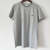 Side profile of Lacoste luxury clothing with logo-detail design