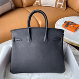  minimalist top-handle bag styled with outfit