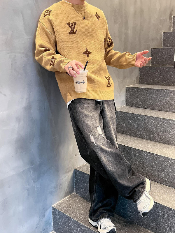 Flat lay presentation of Louis Vuitton luxury clothing with signature branding