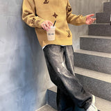 Flat lay presentation of Louis Vuitton luxury clothing with signature branding