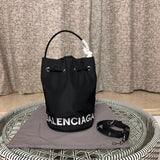 Front view of classic polished women's handbag – women's luxury accessory