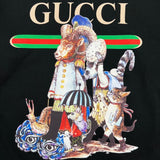 Flat lay presentation of Gucci luxury clothing with signature branding