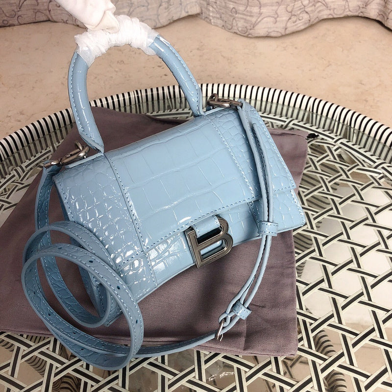 Front view of structured polished women's handbag – women's designer-style accessory
