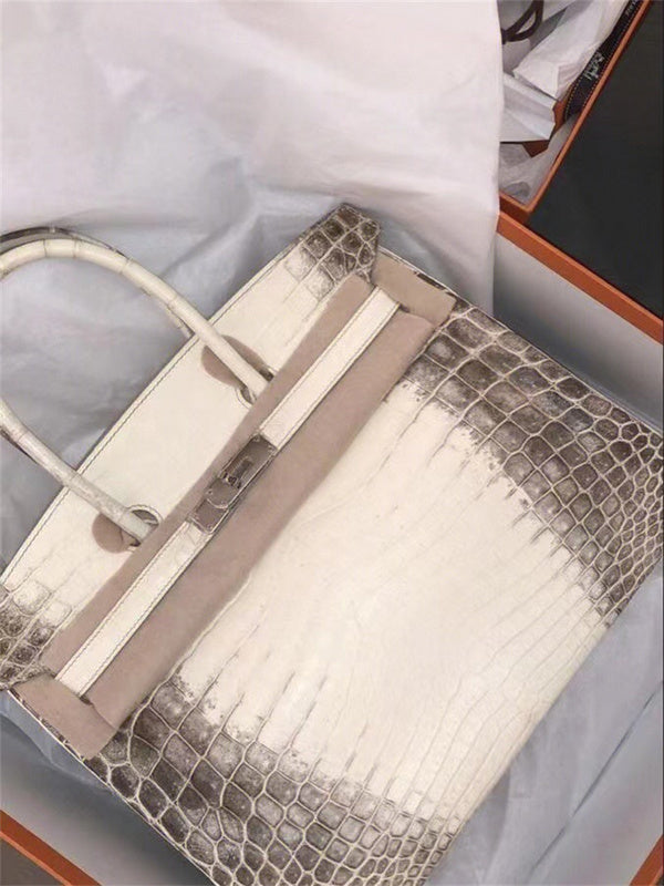  Understated satchel carried on shoulder