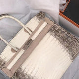  Understated satchel carried on shoulder
