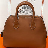 Side view of minimalist structured handbag