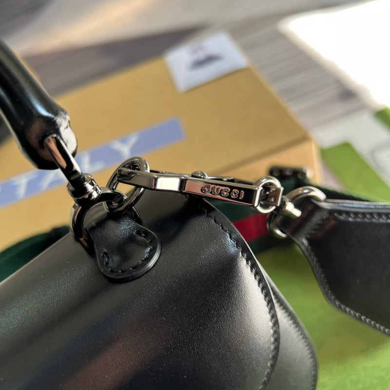 Styled lifestyle shot of polished classic women's handbag – women's designer-style accessory