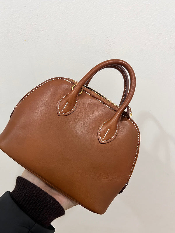 Side view of structured structured handbag
