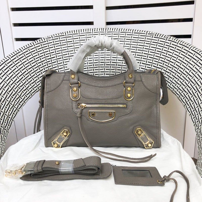 Side profile of sleek polished women's handbag – women's luxury accessory