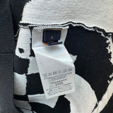 Close-up detail shot of Louis Vuitton luxury clothing with everyday silhouette