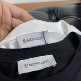 Back view of Moncler luxury clothing with contemporary cut