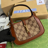 Handle and strap detail of modern statement women's handbag – women's designer-style accessory