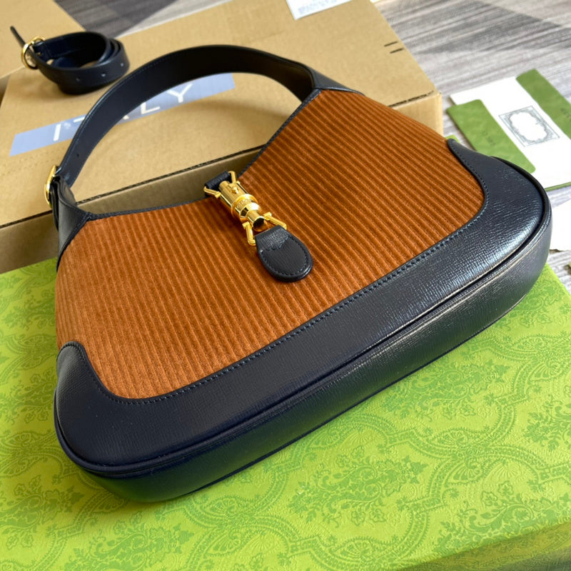 Handle and strap detail of polished structured women's handbag – women's designer-style accessory